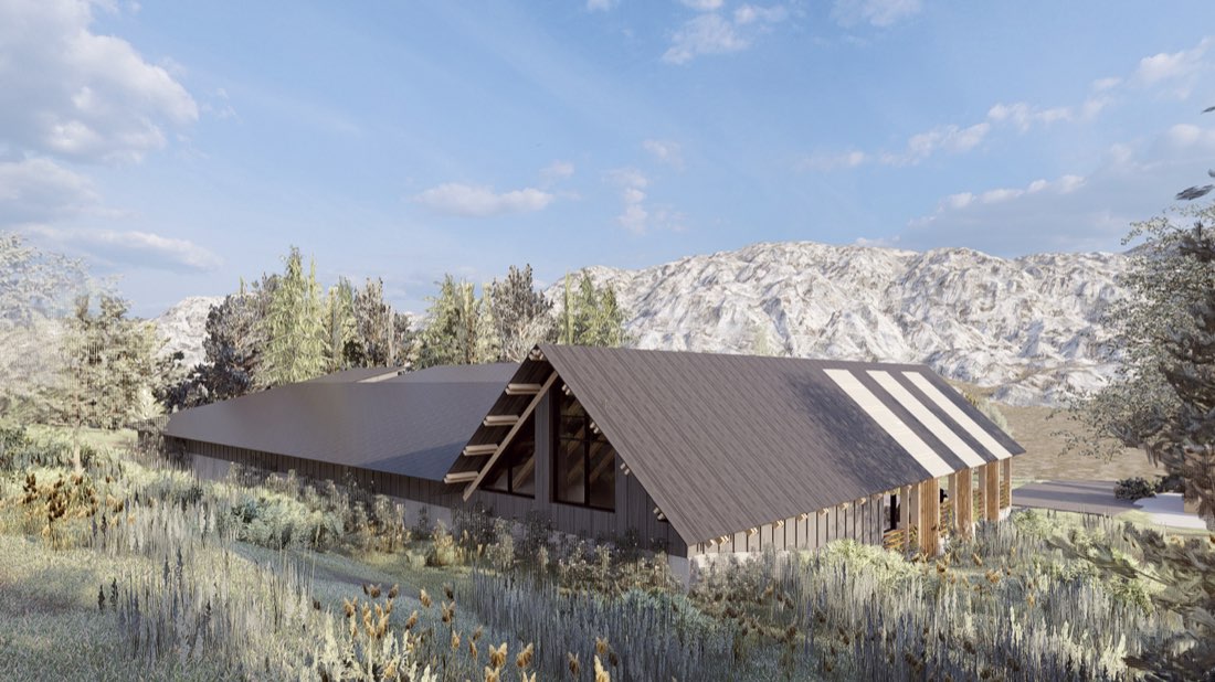 Rendering of the new school from the hillside above, with mountains behind